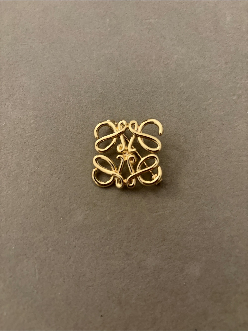 Gold Tone Logo Brooch